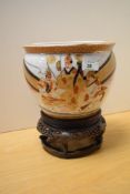 A 20th Century Chinese Satsuma ware style jardiniere, decorated with groups of figures, on stand,