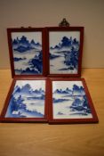A group of four Chinese hand-decorated blue and white panels, of rectangular form, painted in