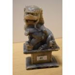 A Chinese soapstone carved Foo Dog statue, measuring 20cm tall