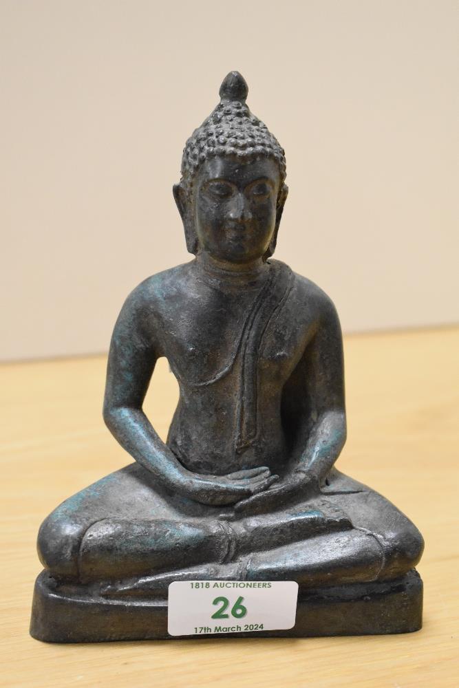 A 19th Century patinated bronze metal Sukhothai Buddha ornament, measuring 15cm tall