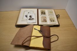 A Victorian embossed and tooled leather bound Cart de Visite album, containing various