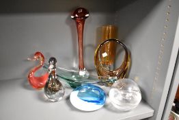 A collection of vintage art glass, including ducks and red and amber glass vases, blue bowl and