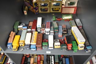 A shelf of Corgi and similar die-casts, Wagons, Articulated Trucks, etc