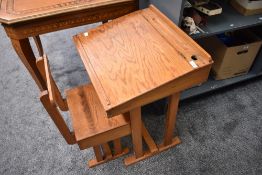 A vintage childs wooden Desk and Chair having lift top