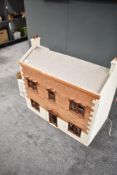 A modern Two-Storey Dolls House having fitted staircase and loose furniture along with a box of