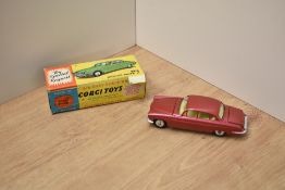 A Corgi die-cast, 238 Jaguar Mark X, metallic rose, small and large suitcases present, in original