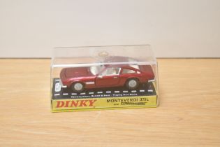 A Dinky die-cast, 190 Monteverdi 375L, red with white interior, on card stand under plastic dome