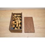 A part turned wooden Chess Set of Staunton or Jaques type, King height 7cm, in wooden box with