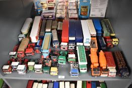 A shelf of Corgi and similar playworn die-casts Wagons, Articulated Truck and Tractor Units