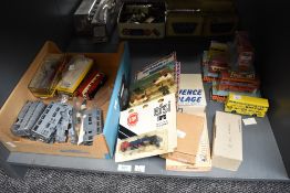 A shelf of metal bus kits, die-cast buses including Dinky, Majorette and Efsi Wagons etc