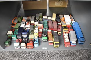 A shelf of Corgi and similar die-casts, Wagons, Tractor Units, Articulated Wagons etc