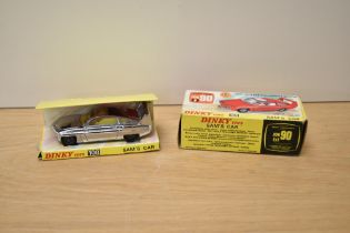 A Dinky die-cast, 108 Sam's Car, silver with yellow interior, on inner card stand with lapel