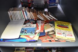 A shelf of Football Programmes, Books and Medallions including Leyton Orient Programmes, 1960's Goal