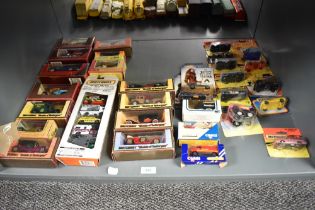 A shelf of 1990's/2000's Matchbox, Corgi and Hot Wheels die-casts, 35 in total, all boxed or on