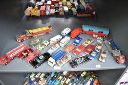 A shelf of Corgi playworn die-casts including Chipperfield Articulated Horse Box with plastic