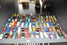 A shelf of playworn die-casts, Corgi Junior, Matchbox Hotwheels, Corgi etc, most in good condition