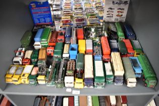 A shelf of Corgi and similar die-casts, Wagons, Articulated Trucks, Accessories etc