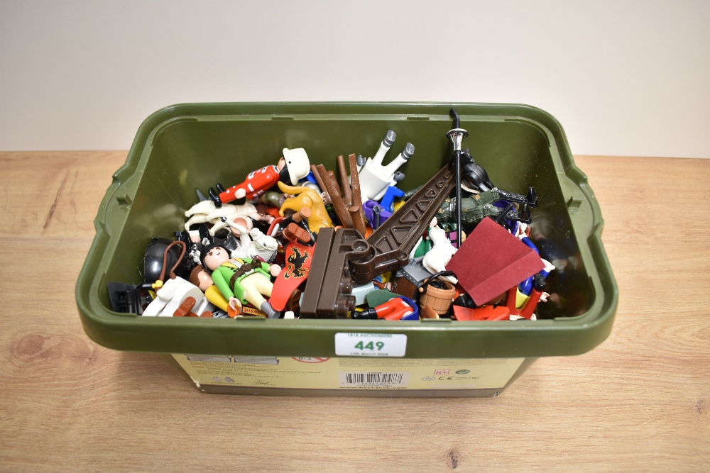 A small box of Lego, Play Mobile and similar plastic figures and accessories