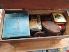 A vintage wooden box of Meccano including Clockwork Motor in original box, parts, whels etc