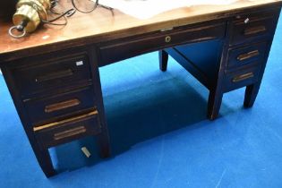 An early to mid 20th Century office desk, labelled Withy Stores Manchester