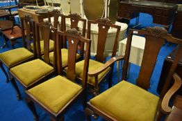 A set of seven (six plus one) early 20th Century oak dining chairs