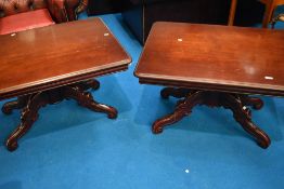 A pair of reproduction mahogany effect coffee tables on scroll frames, approx. 92 x 70cm