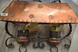 A selection of copper and wrought metal light fittings