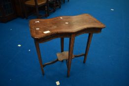 An Edwardian shaped occasional table having mahogany shaped top with inlay including mother of pearl