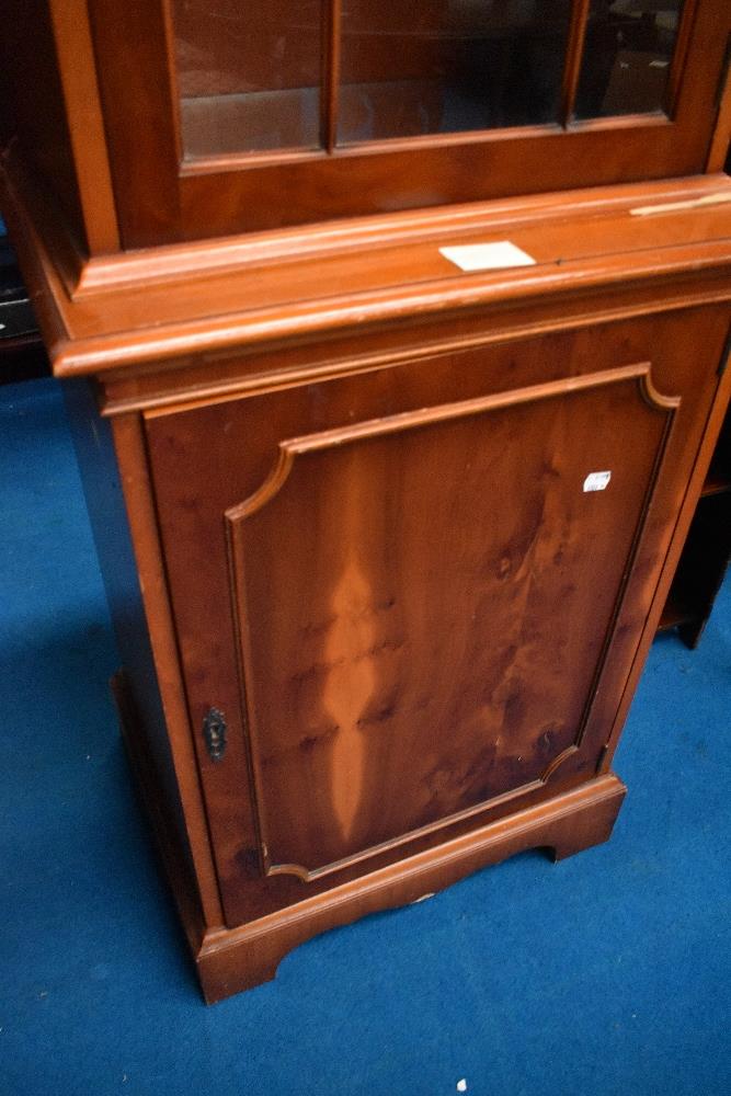 A reproduction yew wood narrow display unit, height approx. 190cm, width 56cm - Image 2 of 3