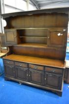 A vintage mahogany effect dresser, possibly Stag