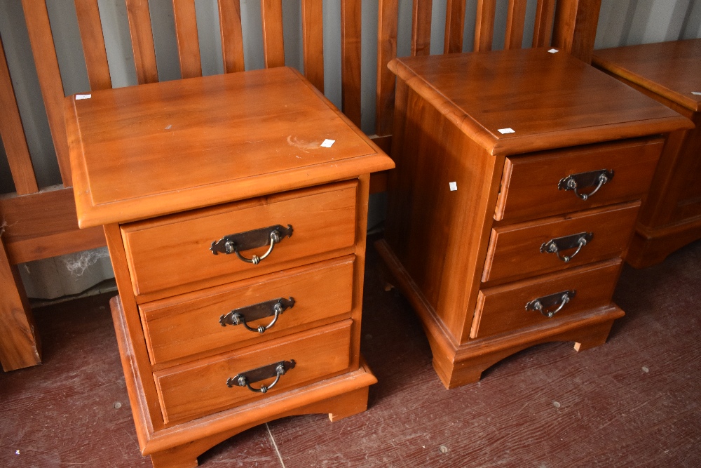 A modern hardwood headboard (w161cm) and two similar bedside chests