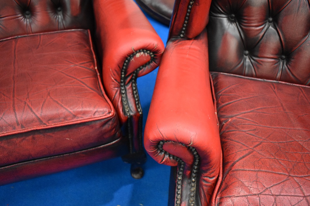 A pair of red leather button back wing armchairs - Image 2 of 2