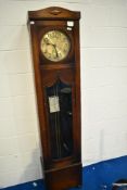 An early 20th Century longcase clock having eight day movement and brass dial with arabic numerals