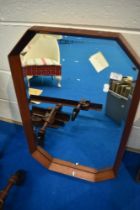 A vintage teak canted wall mirror, approx 44 x 72cm