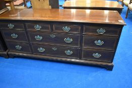 A nice quality reproduction sideboard in the Georgian style having large brass handles , labelled