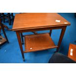 A vintage teak fold over tea trolley, width card table top, labelled Eastcraft , similar to