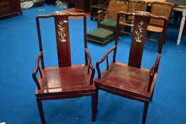 A pair of Oriental hardwood carver chairs having mother of pearl inlay decoration