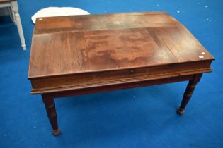 A 19th Century mahogany large clerks desk on married stained frame having turned legs, width approx.