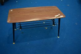 A vintage formica topped coffee table having wire undertier, on dansette style legs, approx. 76 x
