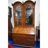 A fine Queen Anne walnut bureau , having double arch topped, Italian style mirrored panels to doors,