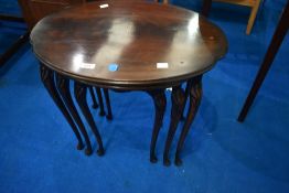 An early 20th Century nest of three oval tables