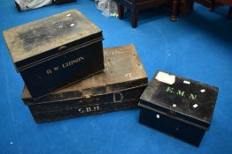 Three vintage tin deed trunks