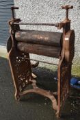 A vintage Pioneer mangle having cast frame