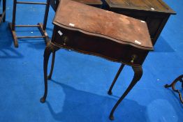An early 20th Century mahogany side table with frieze drawer and shaped front on fine cabriole legs,