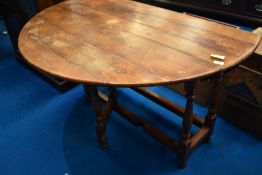 A reproduction gateleg dining table, width approx 127cm