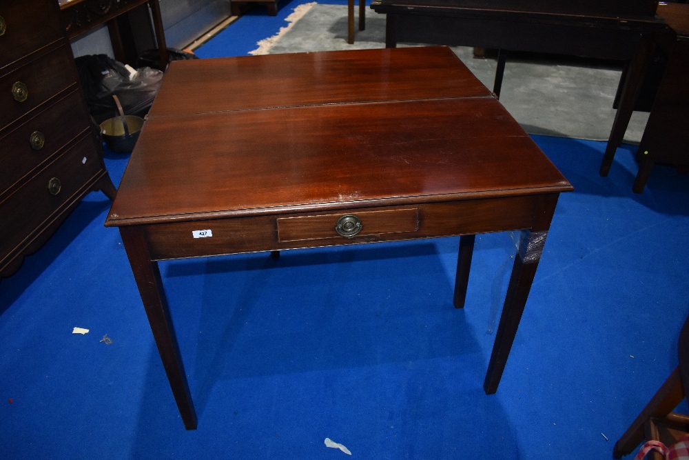 A Regency revival mahogany fold over tea table, width approx. 91cm