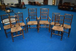 A Harlequin set of Lancashire style spindle back chairs having rush seats (eight - six plus two)