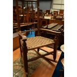 A 19th Century rocking chair having triple spindle back and strung seat