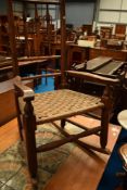 A 19th Century rocking chair having triple spindle back and strung seat