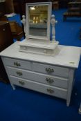 A painted bedroom chest and dressing table mirror with trinket drawer